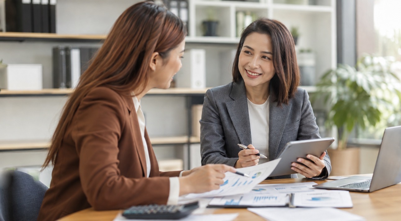 A tax professional reviewing documents with a client